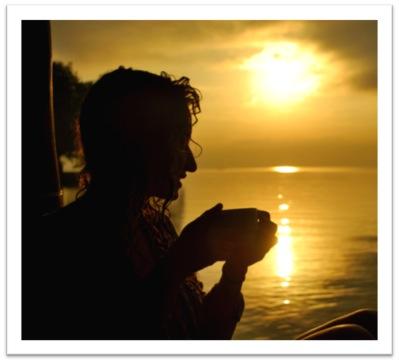 Student at sunrise with coffee